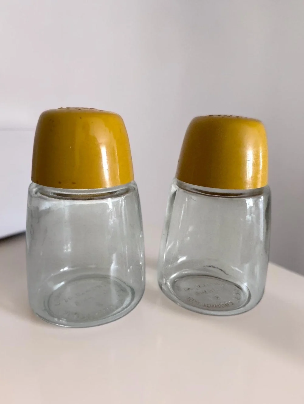 Vintage Mid-Century Modern Glass Salt and Pepper Shakers with Mustard Yellow Lid